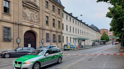 Police cars attend the scene of a stabbing attack in Wuerzburg's Barbarossaplatz. AP