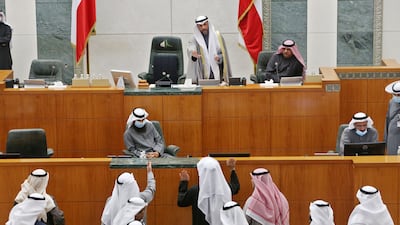 Kuwaiti MPs speak with parliament speaker Marzouq Al Ghanim, top centre, after the national assembly session was adjourned due to cabinet's resignation, in Kuwait City, in 2021. AFP