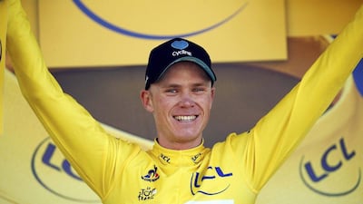 Team Sky rider Chris Froome, new yellow jersey leader, reacts on the podium after winning Stage 8 of the 103rd Tour de France cyling race. Juan Medina / Reuters