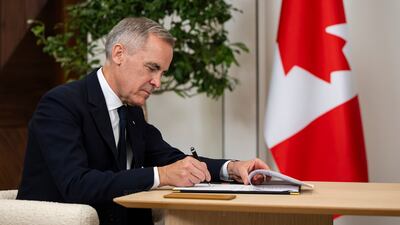 Mr Carney signs a memorandum of understanding between Canada and the UAE