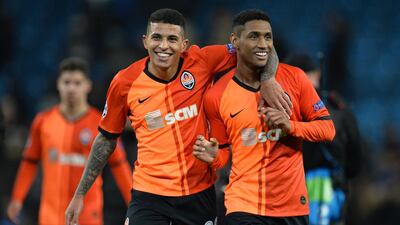 Shakhtar Donetsk's Tete and Dodo (L) greet supporters at the end of the match. EPA