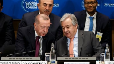 Turkey's President Recep Tayyip Erdogan talks to UN Secretary-General Antonio Guterres during the Global Refugee Forum. AP