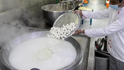 Workers start bright and early at 6am to produce tasty treats for the Hindu festival of light.