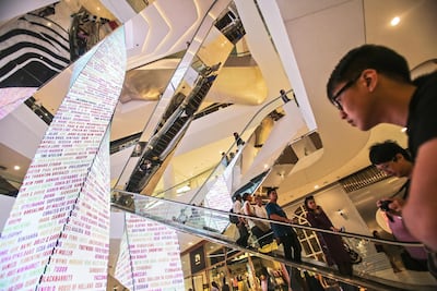 Shoppers at smart Em Quartier mall. Dario Pignatelli / Bloomberg