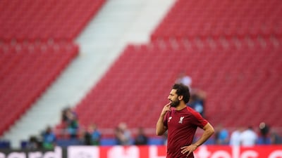 Salah is caught deep in thought during training. EPA