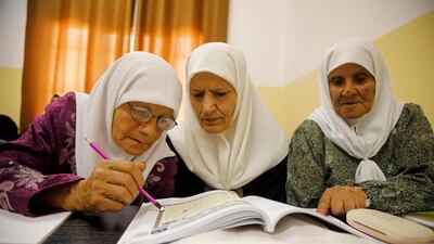 Palestinian woman Seham Somodi, 66, takes part in a literacy class with her colleagues at Al Yamoun Community Center where they learn reading, writing and using computer, in Al Yamoun town in the Israeli-occupied West Bank. Reuter