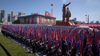 Students march past a balcony from where North Korea's leader Kim Jong Un was watching, during a mass rally on Kim Il Sung square in Pyongyang. AFP