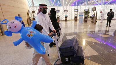 Saudi passengers enter King Abdulaziz International Airport in Jeddah, Saudi Arabia. AP