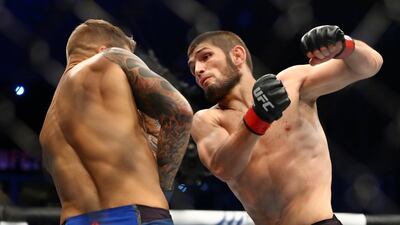 Khabib Nurmagomedov, right, during his win over Dustin Poirier at UFC 242 in Abu Dhabi. AP