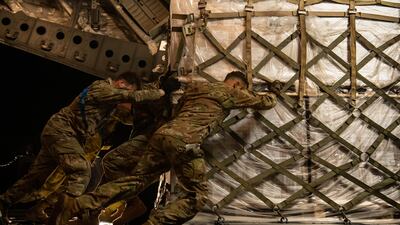 US airmen load a pallet of baby formula on to a C-17 Globemaster lll aircraft in Germany, as part of Operation Fly Formula. US Air Force / EPA