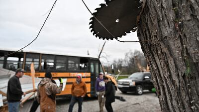A saw blade is embedded in a tree after the tornado in Sullivan. Reuters