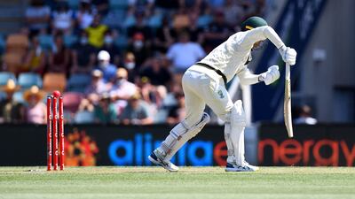 Alex Carey is bowled by England's Chris Woakes for 24 in Australia's first innings. AFP