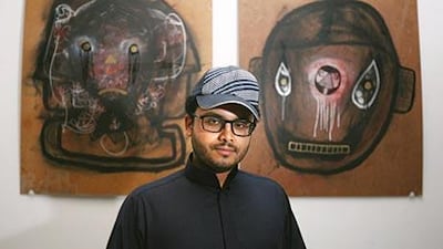 Gallery owner and art collector Rami Farouk next to one of his favorite pieces from his personal collection, "Identical Sins" by local artist Ubik.