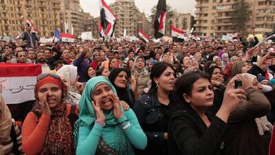 Protesters chant slogans and wave national flags in Tahrir Square in Cairo, Egypt. Maya Alleruzzo / AP Photo