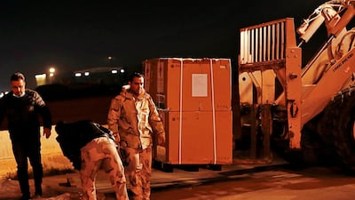 Air freight workers unload the first batch of the Sinopharm vaccine at Baghdad International Airport, Baghdad. As of March 1, Iraq had recorded about 700,000 cases of Covid-19, with more than 13,400 deaths. AP Photo