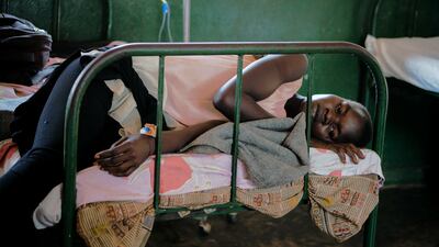 A malaria patient rests on a bed after being discharged in Kiryandongo, northwestern Uganda, on April 11, 2017. AFP