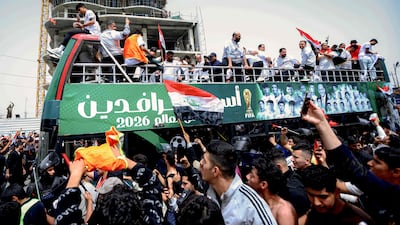 Fans greet the Iraqi national team in central Baghdad. AFP