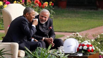 US president Barack Obama and India's prime minister, Narendra Modi, talk as they have coffee and tea together in the gardens of Hyderabad House, New Delhi, on January 25, 2015. Jim Bourg/File Photo/Reuters