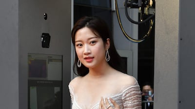Actress Moon Ga-young walks through a thermal camera system as she arrives on the red carpet of the 56th annual Daejong Film Awards. AFP