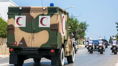 The convoy carrying the body of Tunisian President Beji Caid Essebsi arrives at the presidential palace in Carthage, near Tunis, Tunisia. AP Photo