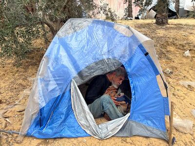 A Palestinian man with disabilities sits inside a tent in Nasser Hospital in Khan Younis in the southern Gaza Strip on Sunday. Reuters