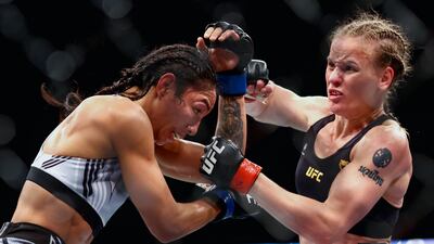 Valentina Shevchenko exchanges strikes with Taila Santos during their fight at UFC 275. Getty