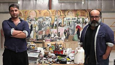 The Iranian painters Rokni, left, and Ramin Haerizadeh at their studio in Al Quoz. They will exhibit their creations in Paris from June 5.