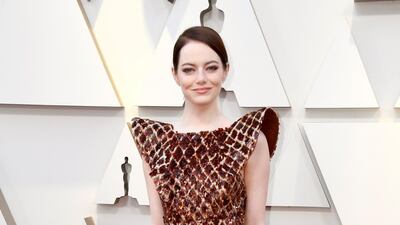2019: Emma Stone went for a statement shoulder Louis Vuitton snake print dress for the 91st Annual Academy Awards. AFP