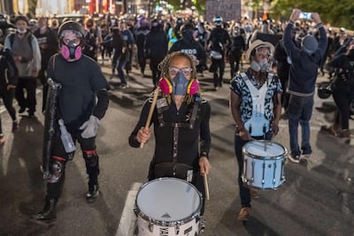A crowd marches through Portland, Oregon on September 19, 2020 as protests against police brutality and racial injustice resumed after being suspended because of air pollution from bushfires in the state. Getty Images / AFP