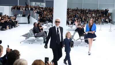 Designer Karl Lagerfeld, Hudson Kroenig and model Cara Delevingne at Chanel's Womenswear Spring/Summer 2016 show. Rindoff / Le Segretain /Getty Images