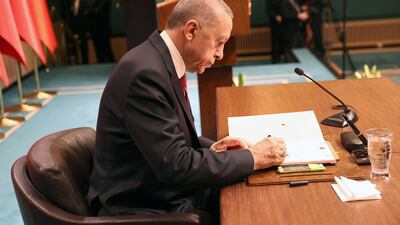 Turkish President Recep Tayyip Erdogan signs a decree announcing that general national elections will he held on May 14. Turkish law says the only circumstances in which any national vote can be postponed is if the country is at war. AFP