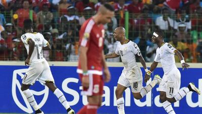 Ghana’s midfielder Andre Ayew (2ndR) celebrates after scoring a goal during the 2015 African Cup of Nations semi-final football match between Equatorial Guinea and Ghana in Malabo, on February 5, 2015. AFP PHOTO / ISSOUF SANOGO