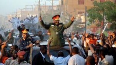 Omar al Bashir parades in the streets of Khartoum and waves to supporters on March 4 2009 after the ICC issued a warrant for his arrest over alleged war crimes.