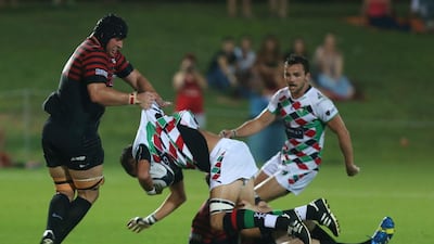 Harlequins, in green/red/white and Saracens, black and red, shown during a UAE Premiership match last month. Delores Johnson / The National / September 24, 2015