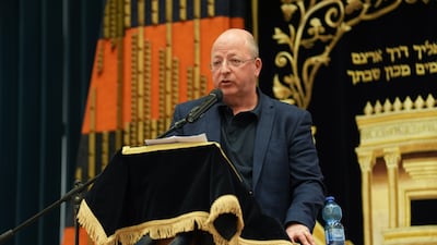 Lawyer Adam Rose addresses the crowd in London. PA