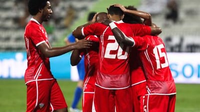 The UAE national team celebrate scoring against Uzbekistan during a friendly in Dubai