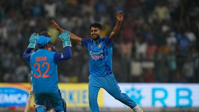 India's Umran Malik celebrates the wicket of Dasun Shanaka during the first T20 in Mumbai. Malik bowled at a top speed to 155kph in India's win on Tuesday. AP