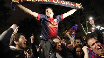 Supporters celebrate after Barcelona win their 22nd Primera Liga title. Marta Perez / EPA