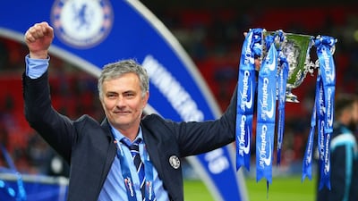 Jose Mourinho poses with the League Cup trophy after guiding Chelsea to victory over Tottenham on March 1. Clive Mason / Getty Images