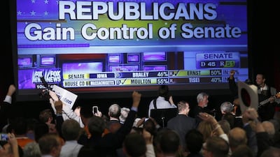 Republican supporters cheer as a giant TV screen displays the results of the senate race in the US midterm elections on November 4, 2014. Rick Wilking / Reuters