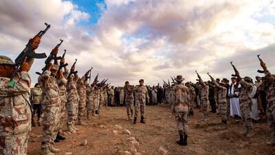 Fighters fire rounds in the air during the funeral of General Wanis Bukhamada of the Libyan National Army (LNA), loyal to Khalifa Haftar, in Benghazi on November 1, 2020. AFP