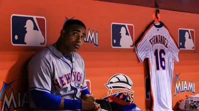 New York Mets outfielder Yoenis Cespedes looks on from the dugout next to a Mets jersey honouring late Miami Marlins pitcher Jose Fernandez. Rob Foldy/Getty Images