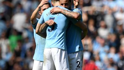 Manchester City's Kyle Walker celebrates with John Stones following their Premier League match against Tottenham Hotspur. Getty Images
