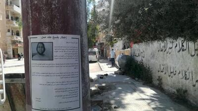 A wanted poster is seen in Idlib, Syria.