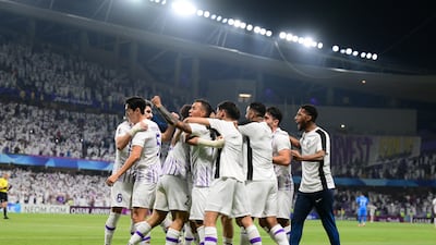 Al Ain's players celebrate with Soufiane Rahimi.