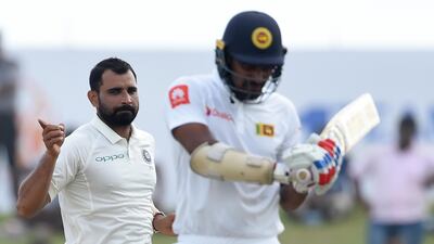 India fast bowler Mohammed Shami, left, celebrates after dismissing Sri Lanka batsman Danushka Gunathilaka in Galle on Thursday. Ishara S Kodikara / AFP