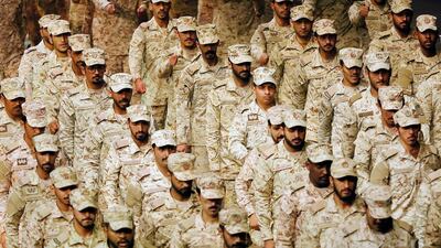 Saudi soldiers parade during a concert titled "mettle to the top" at the green hall theatre marking Saudi 89th National Day celebrations in Riyadh, Saudi Arabia, on September 21, 2019. AP