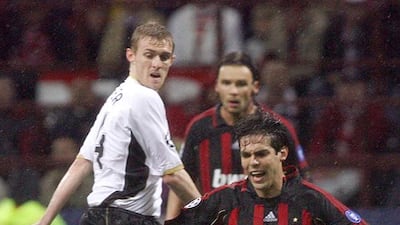 AC Milan's Kaka is tackled by United midfielder Darren Fletcher. AFP