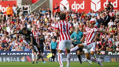 Brazilian Philippe Coutinho, far left, fires home the late winner for Liverpool against Stoke City at the Britannia Stadium on Sunday. Darren Staples / Reuters