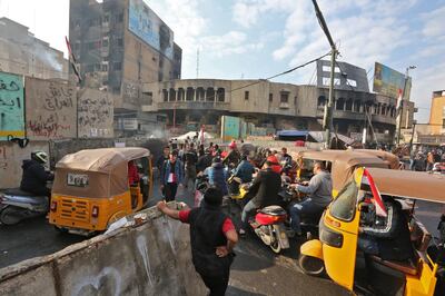 Iraqi anti-government protesters gather in the capital's Tahrir Square on December 11, 2019. AFP / SABAH ARAR